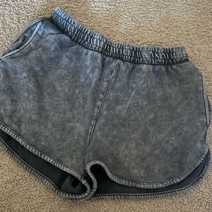 Gray Athletic Shorts with Elastic Waistband and Curved Hem